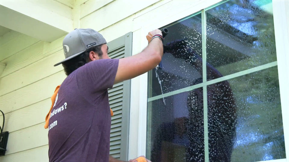 Belle technician providing professional window cleaning